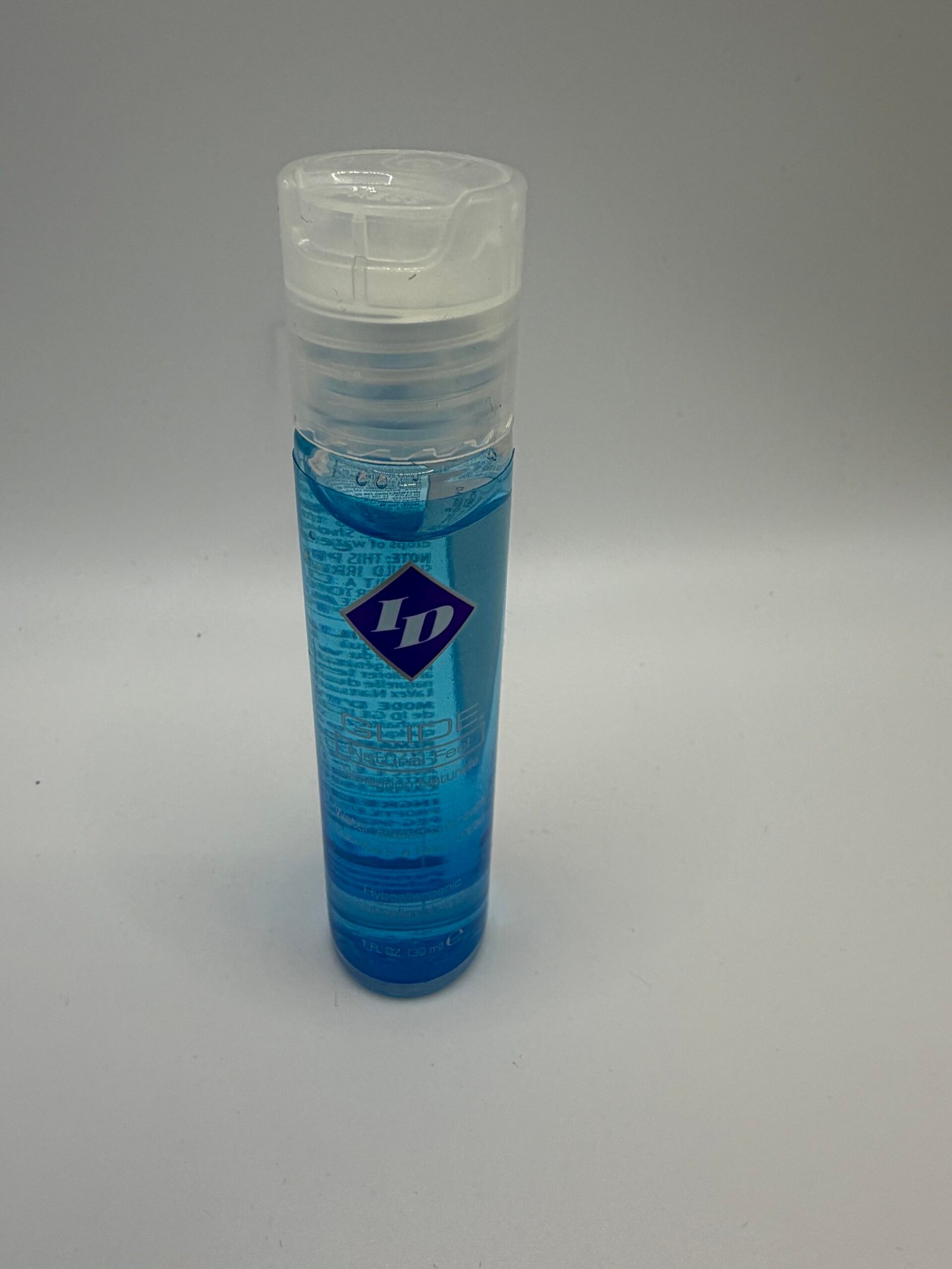 ID Glide water-based personal lubricant in a clear 1 fl oz bottle, featuring a natural feel formula and hypoallergenic label.