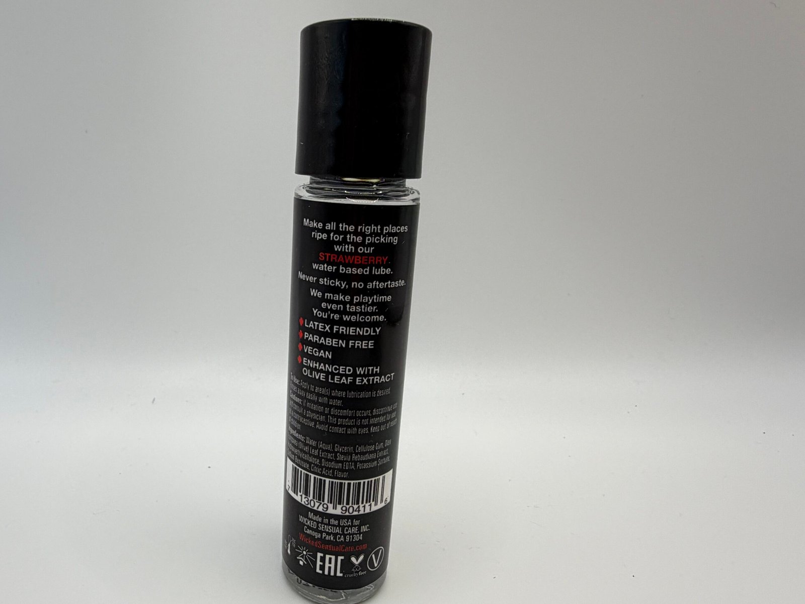 Wicked Sensual Care Strawberry flavored water-based intimate lubricant in a 1.0 fl oz bottle, featuring a vegan and paraben-free formula